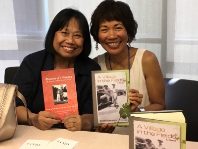 Vickie Santos and me at the FANHS Bay Area Consortium table with our books.