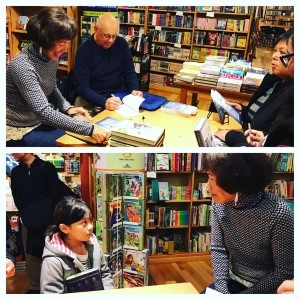 Signing books with Bob, and meeting Devin's daughter, Vita (photo courtesy of Devin Israel Cabanilla).