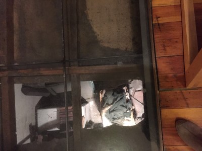 The window to the basement: the contents belonging to interned Japanese-American families have never been touched since they were left there during WWII. A chilling and sad sight.